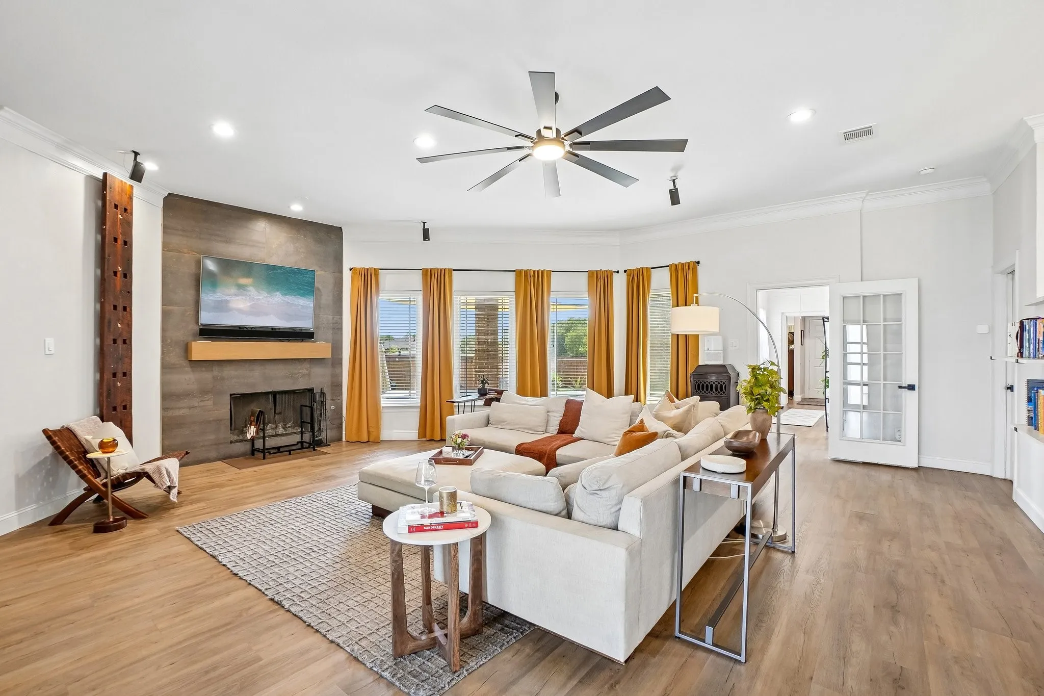 Wood-finish flooring, recessed lighting, and crown molding