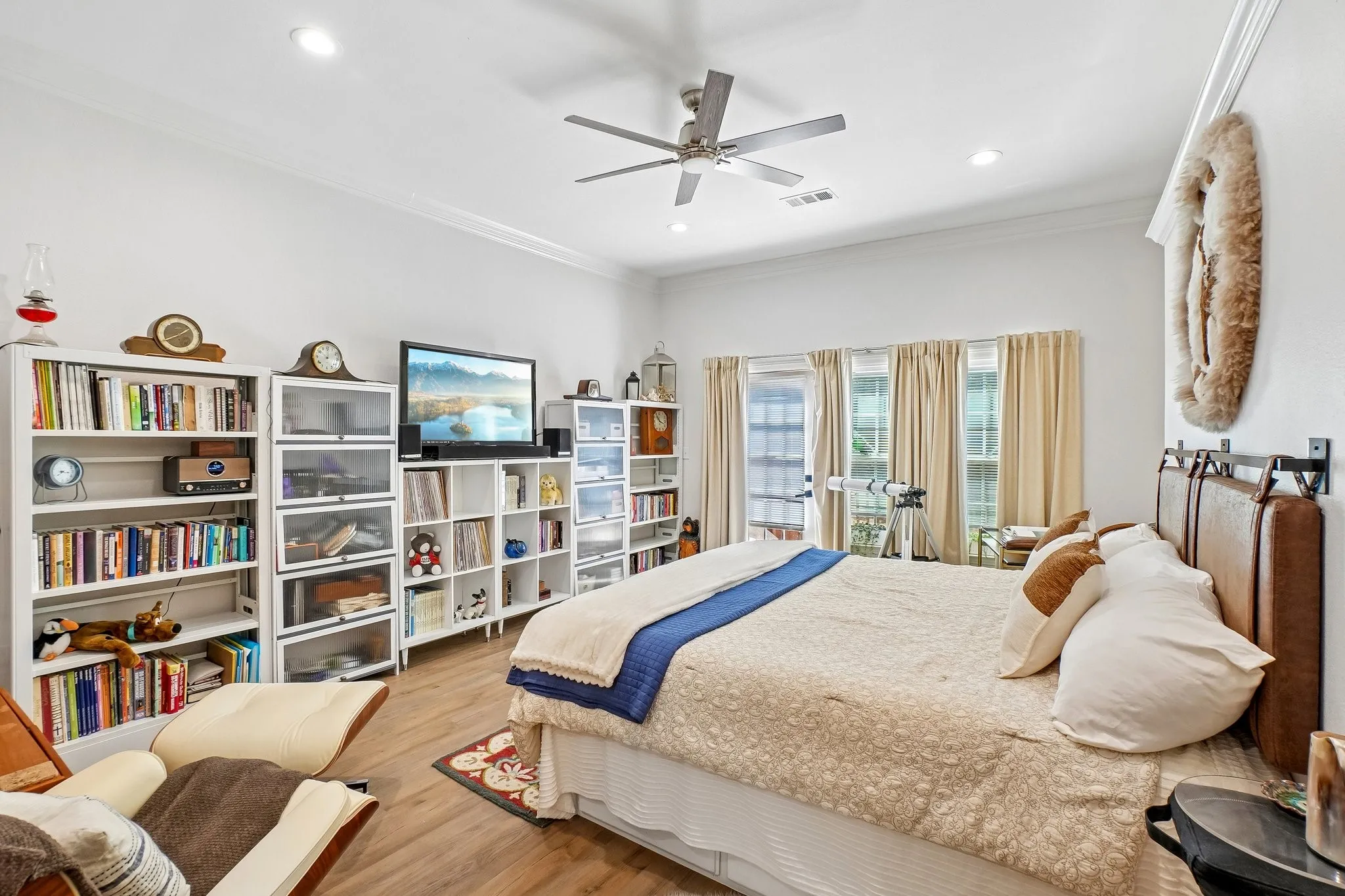 Crown molding, recessed lighting, ceiling fan, wood-finish flooring, and exterior access