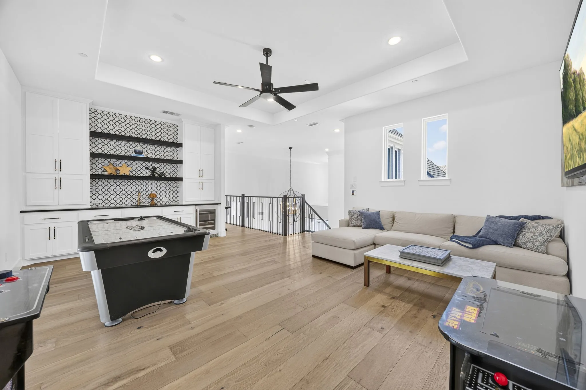Upstairs game room has its own snack bar with sink and beverage fridge.