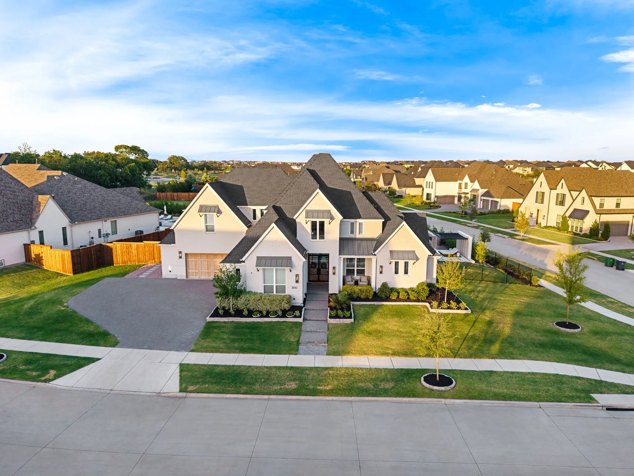 Over 1/2 an acre, corner lot with expanded brick paved driveway and 4 car garage.