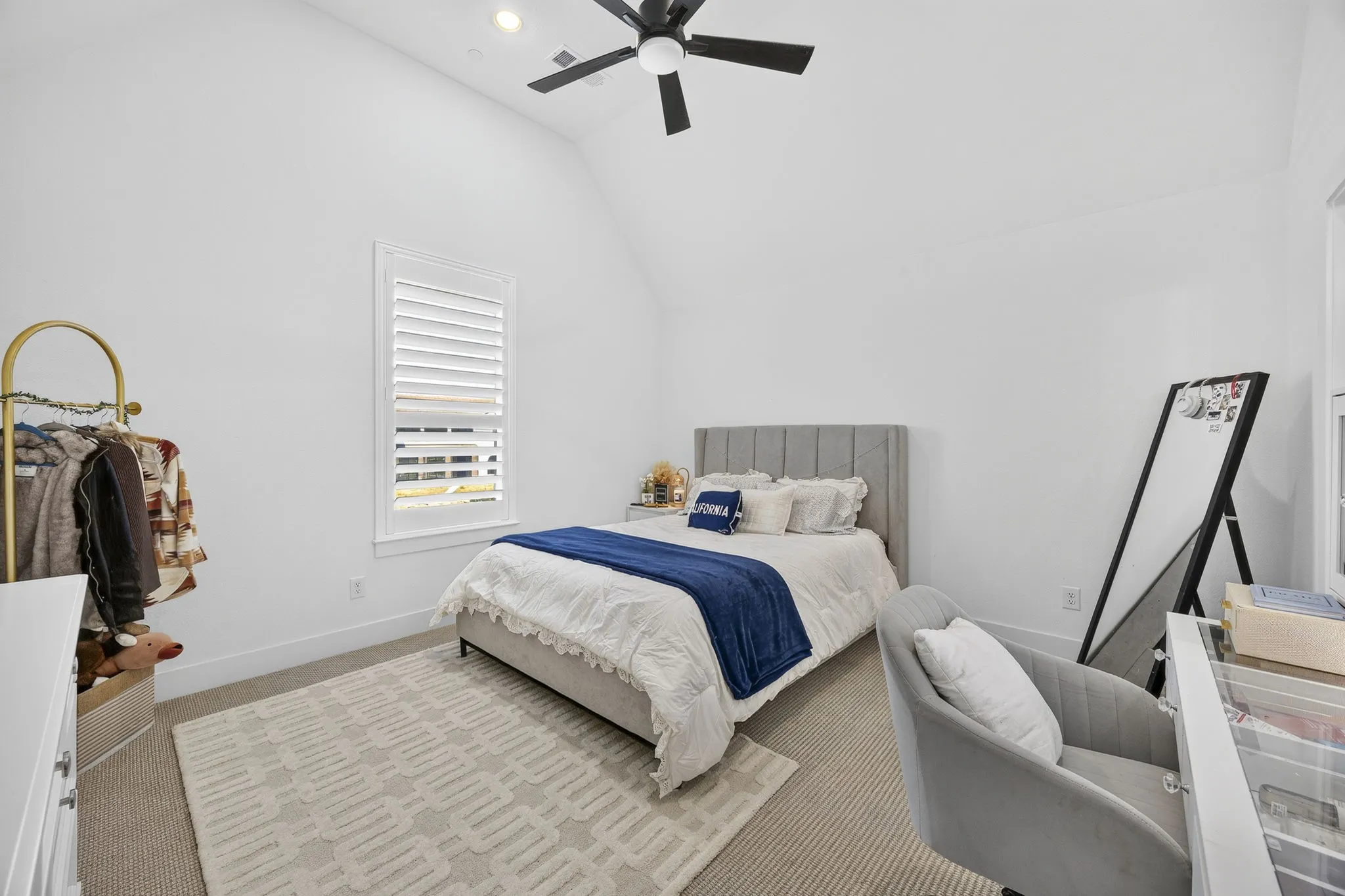 Upstairs bedroom front left side of the home features an ensuite bath with walk in shower.