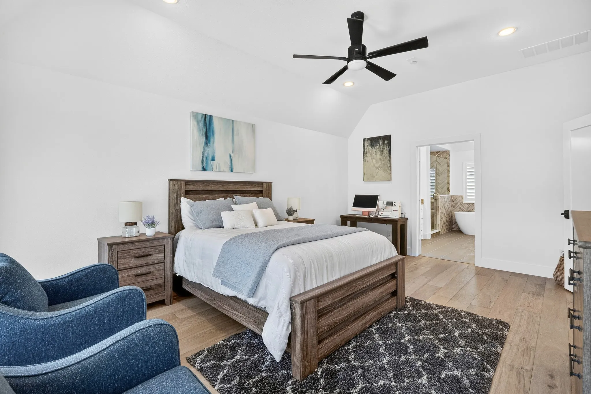 Upstairs second primary suite--huge 19ft bedroom and massive bath with dual vanities, soaking tub and separate shower.