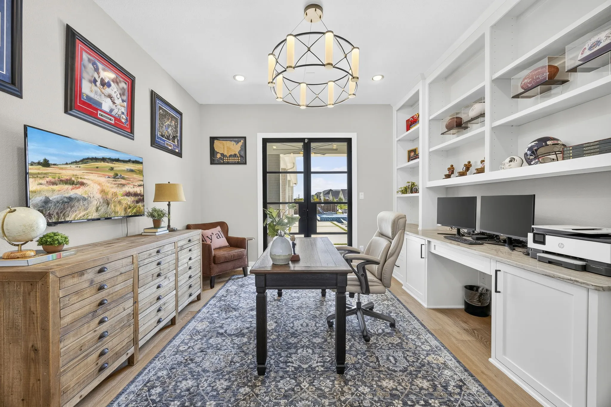 Home offices has its own doors out to the covered patio.
