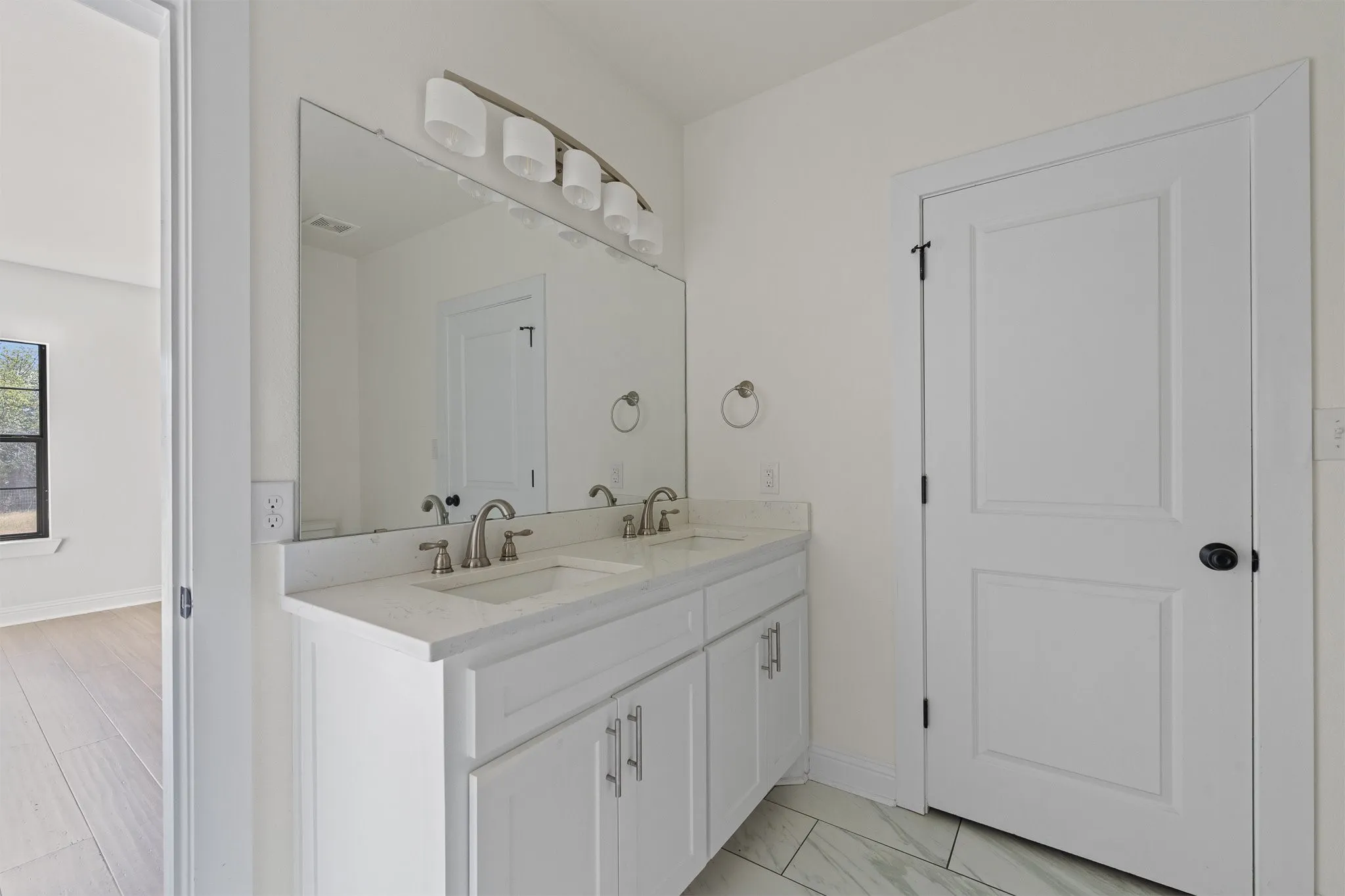 master bathroom with his and her sinks.