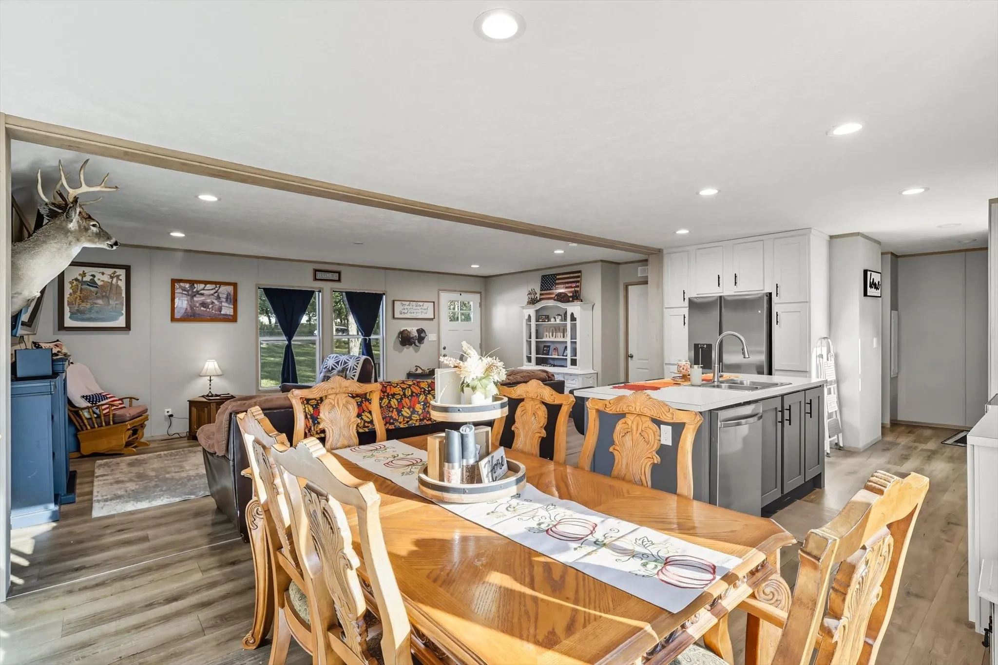 Dining area featuring light wood-style floors and recessed lighting
