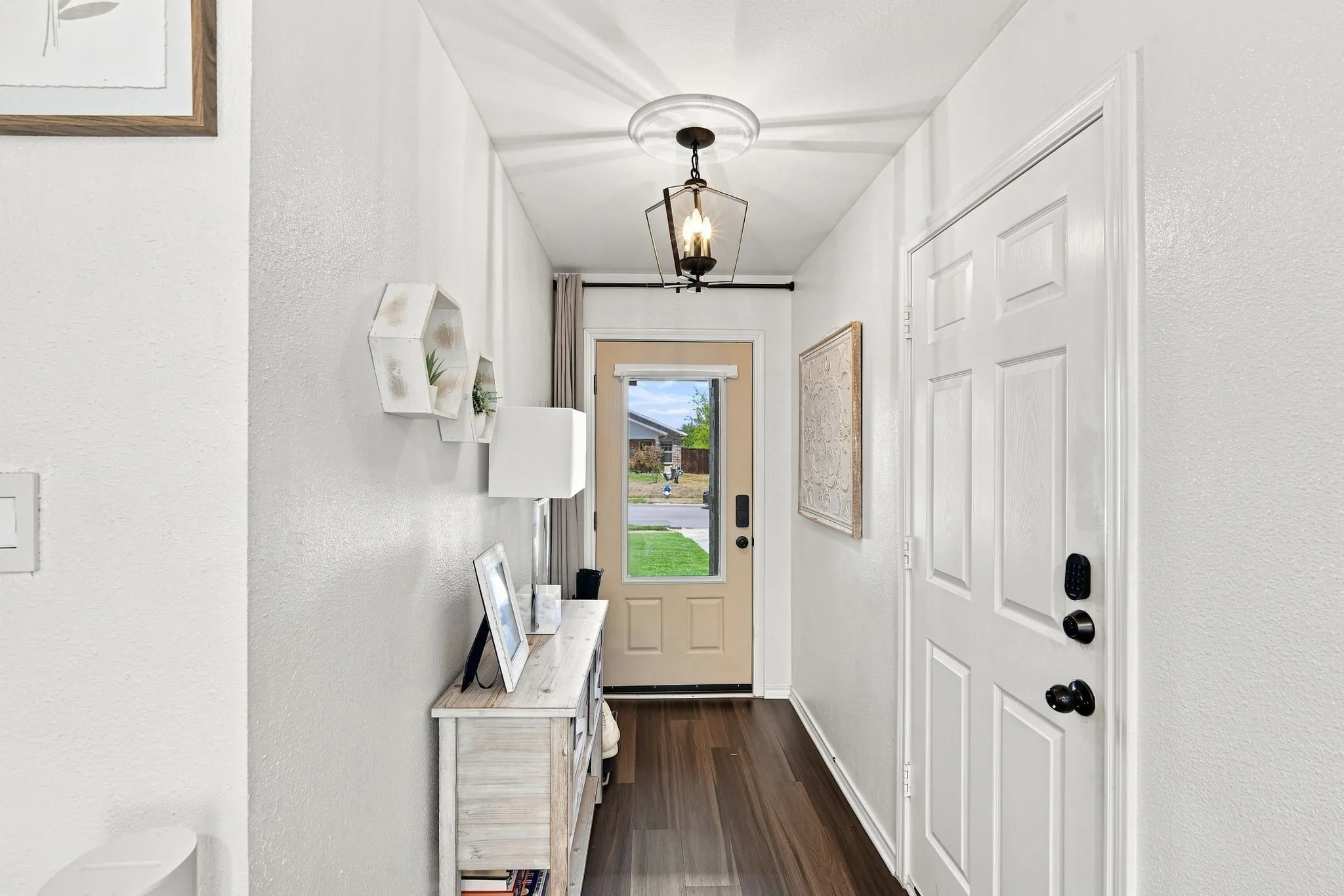A bright, welcoming entry that instantly feels like home — clean lines, natural light, and a calm first impression