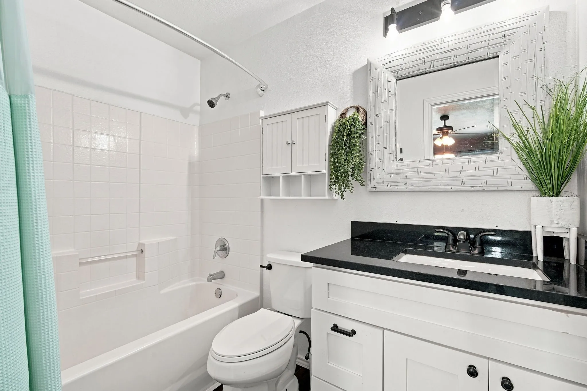 Fresh, updated bath with modern finishes and warm décor touches, simple, clean, and move-in ready