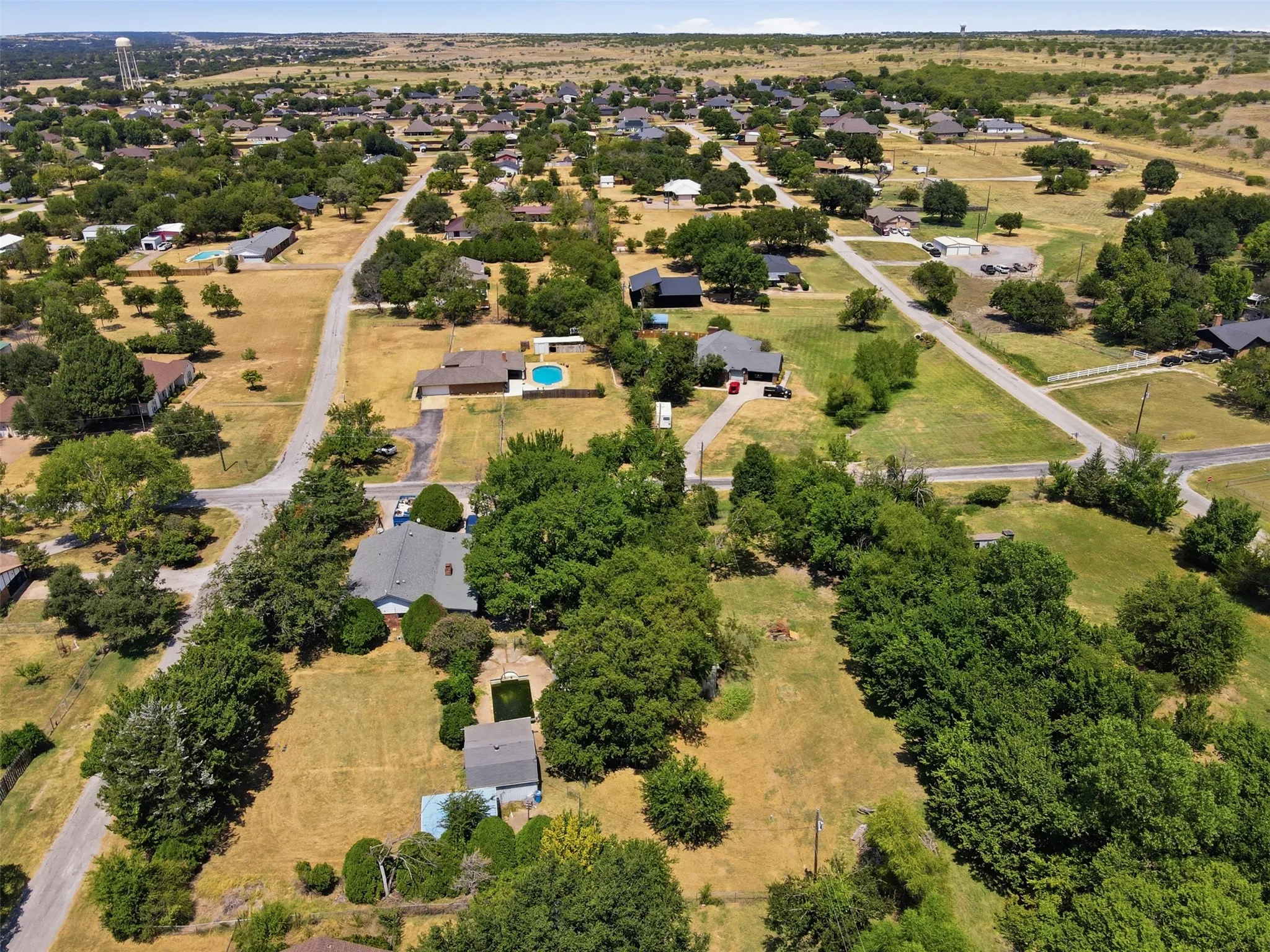 Expansive land parcels with scattered residential structures