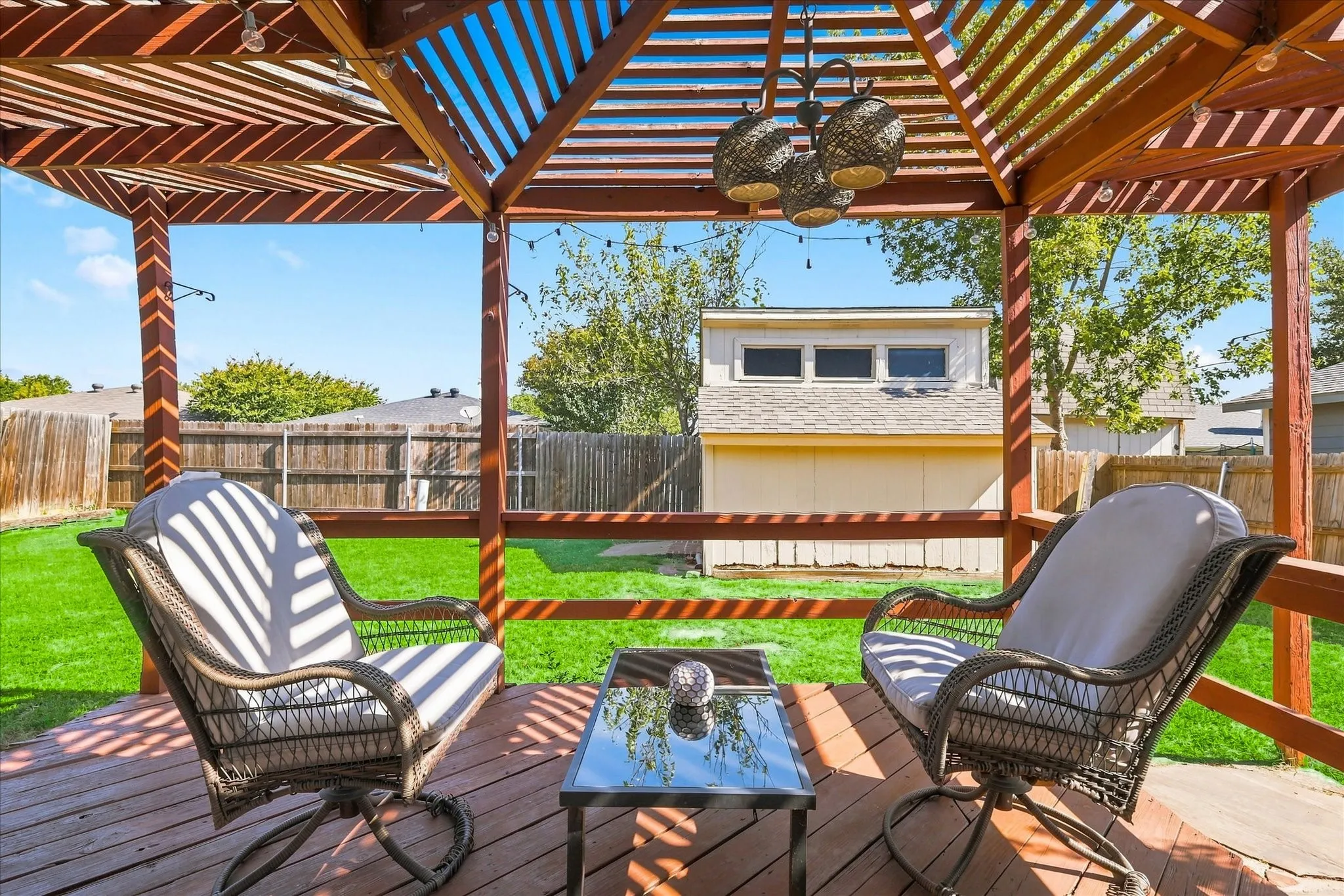 Cute chandelier for backyard deck.