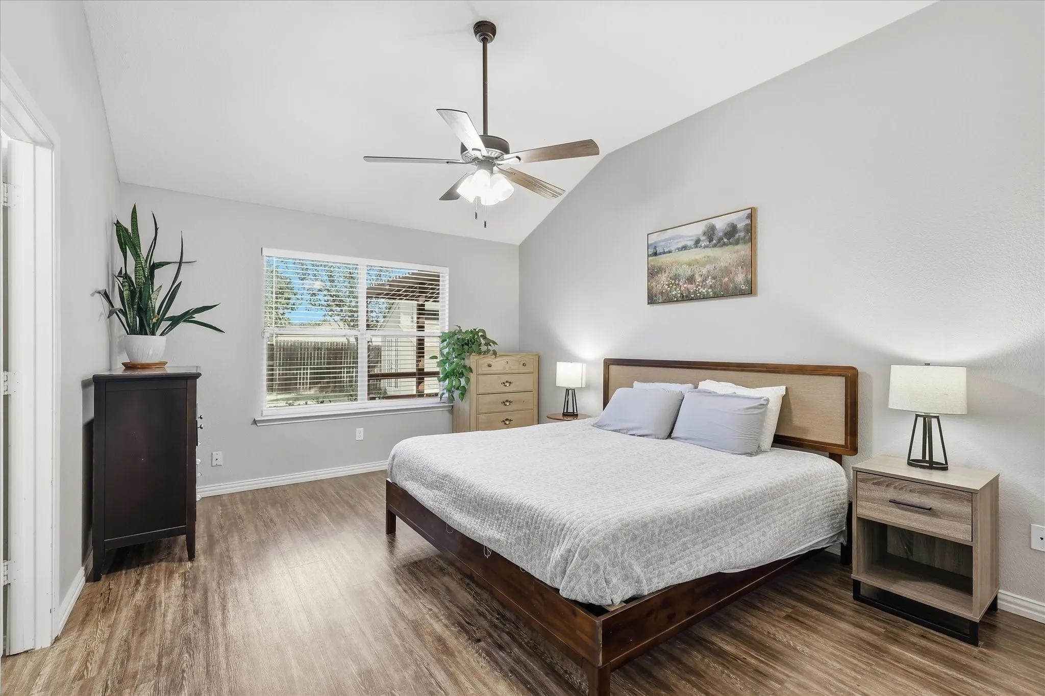 Primary Bedroom with raised ceilings.