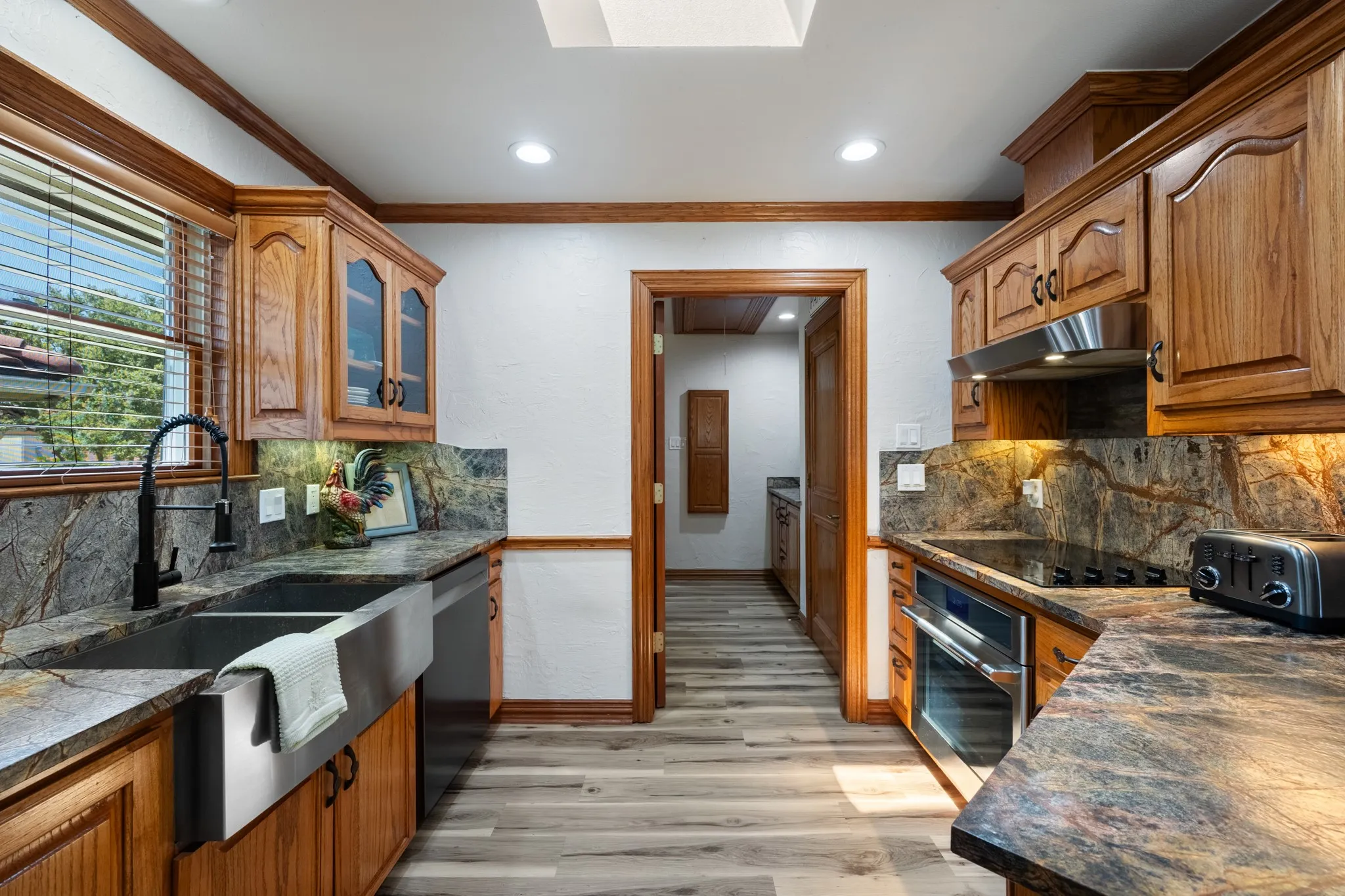 Recently remodled kitchen including appliance, countertops and farm sink