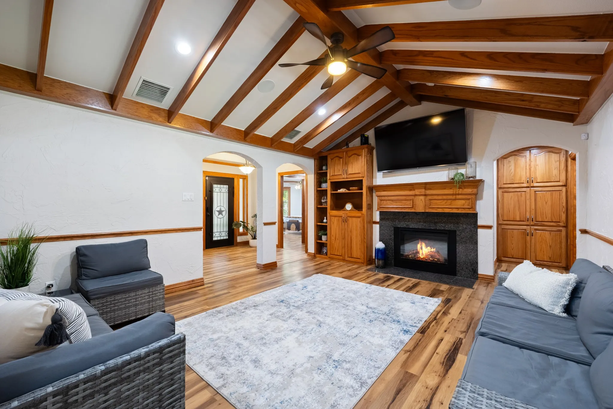 Beautiful family room with custom ceiling, built-ins and fireplace