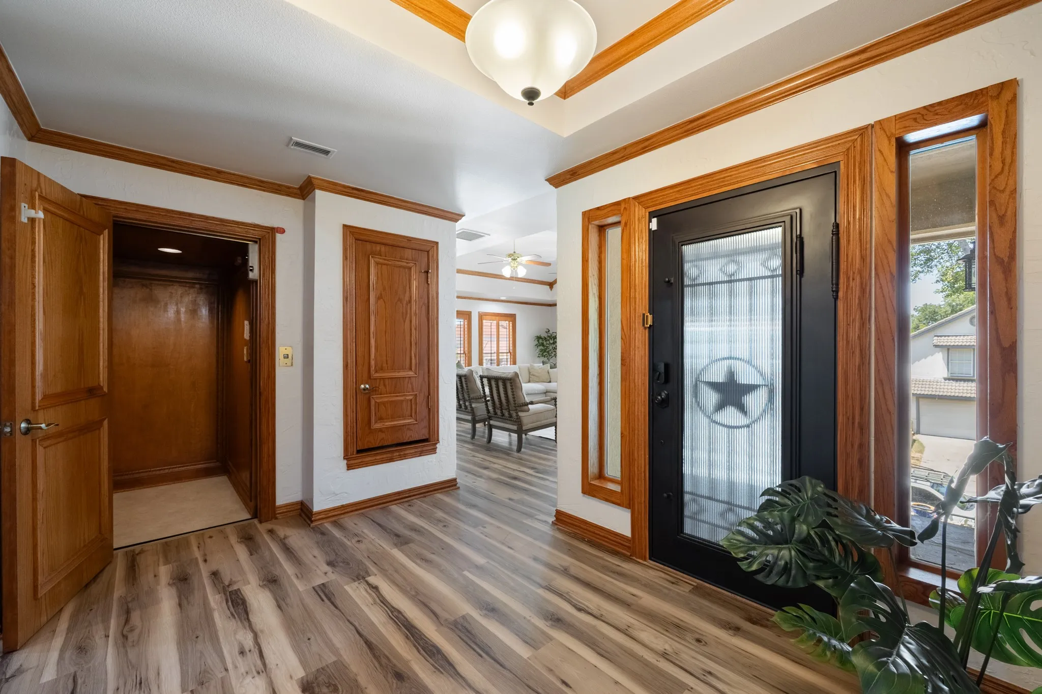 Spacious entry with richly appointed elevator from the garage to the main level of the home