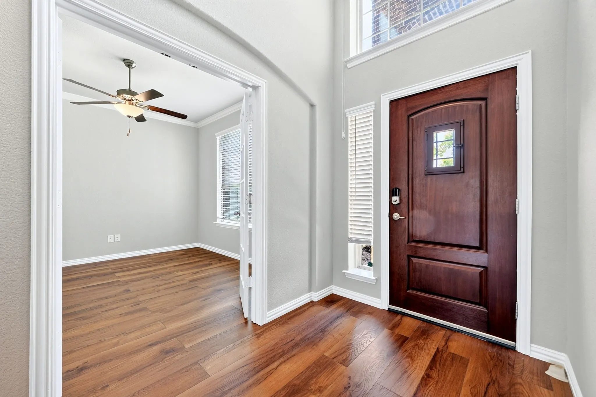 Arch-top entry door with decorative glass insert