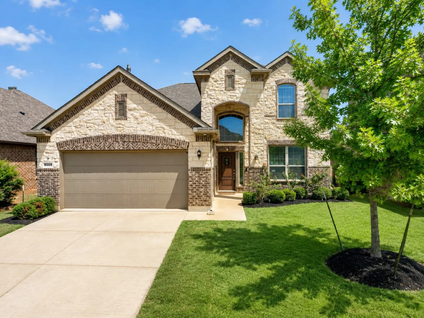 Stone and brick facade with arched accents