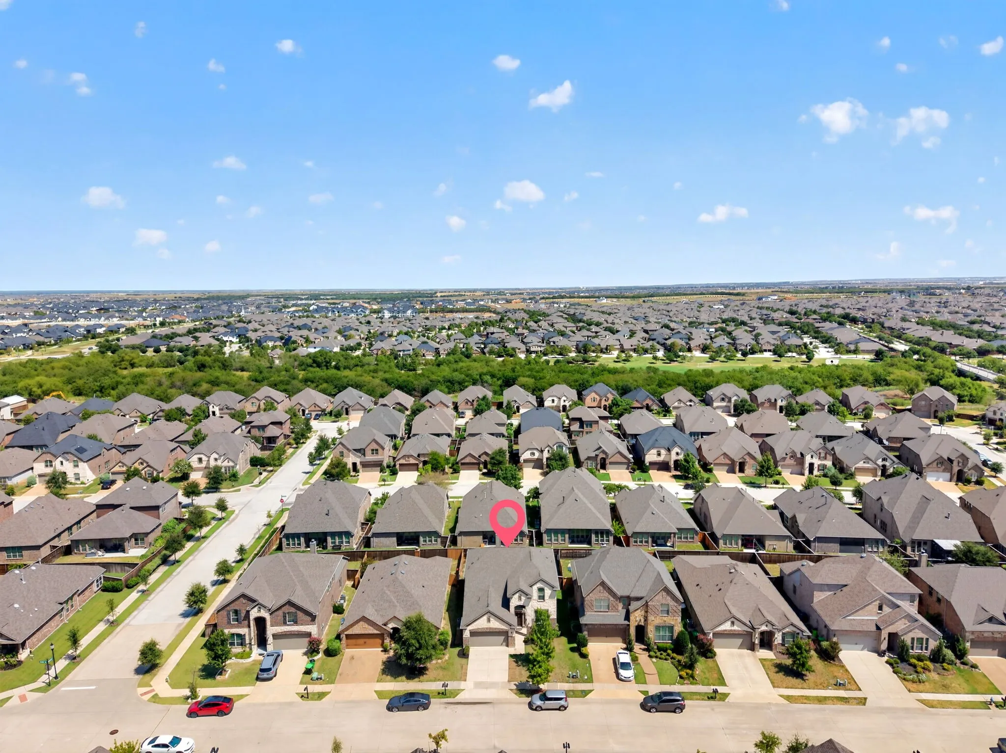 Neighborhood setting with uniform rooflines and a mix of single-story and two-story properties