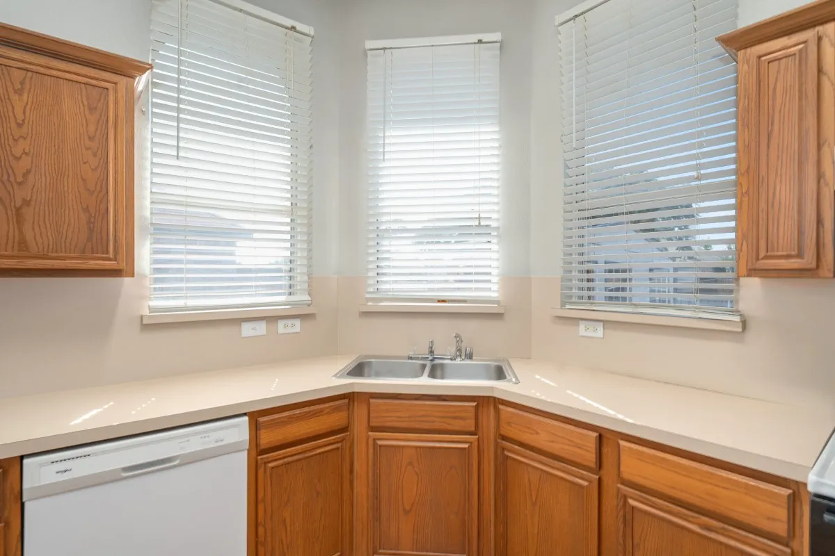 Watch your backyard from the large windows over the kitchen sink