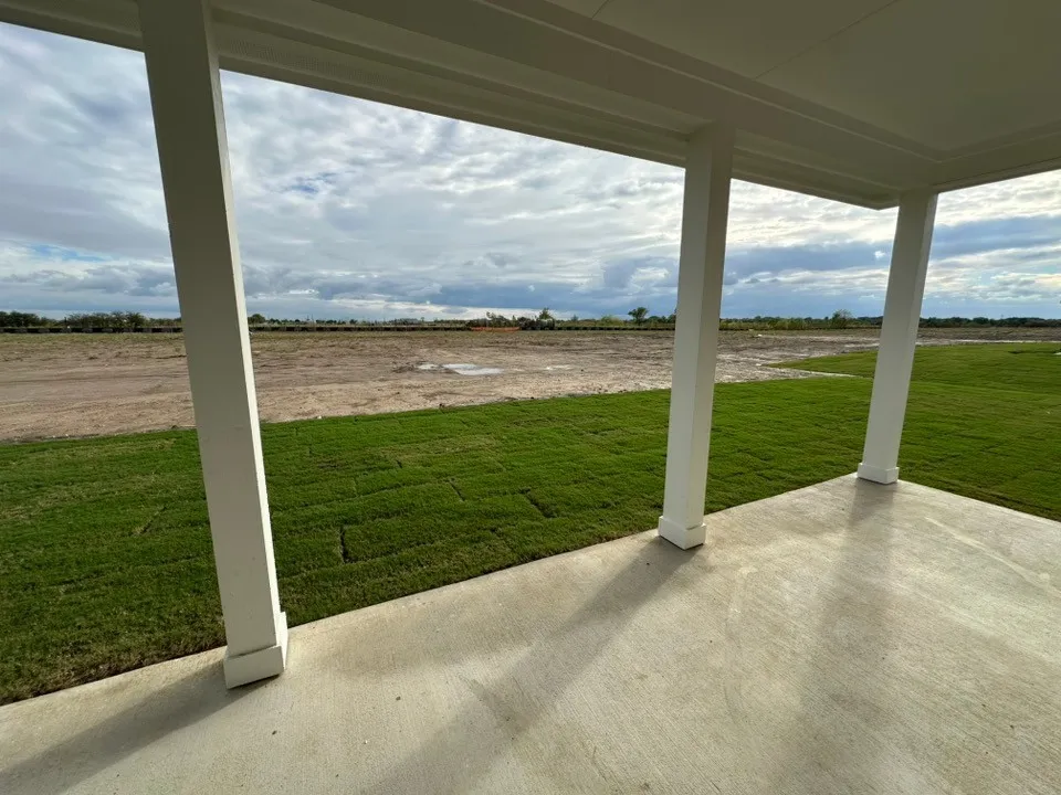 Covered outdoor patio with a concrete surface