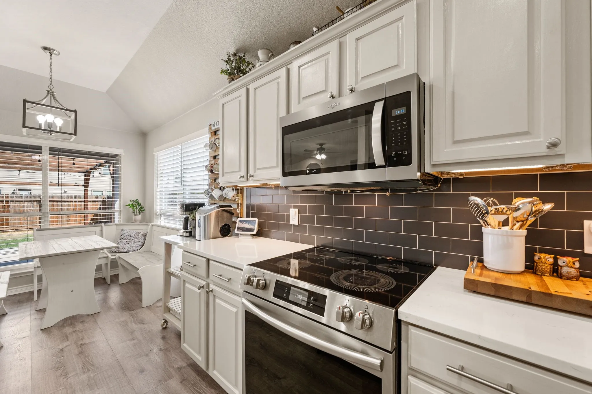 greige cabinetry, quarts tops, under counter lighting
