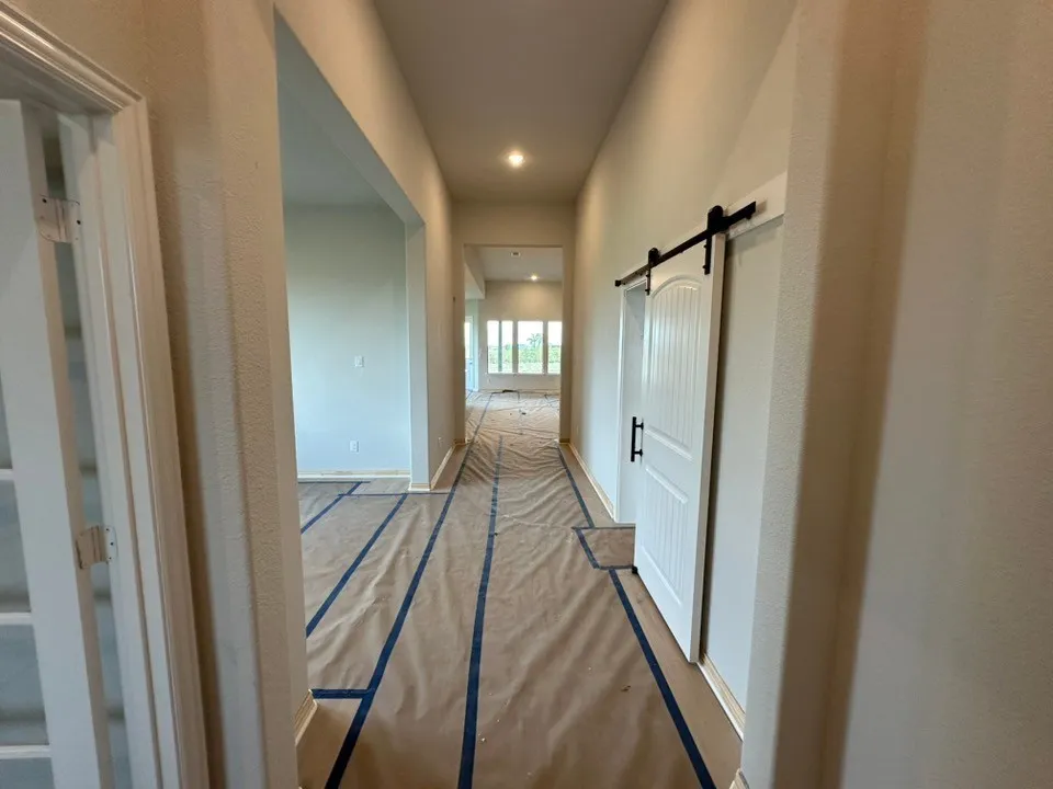 Recessed lighting throughout the hallway