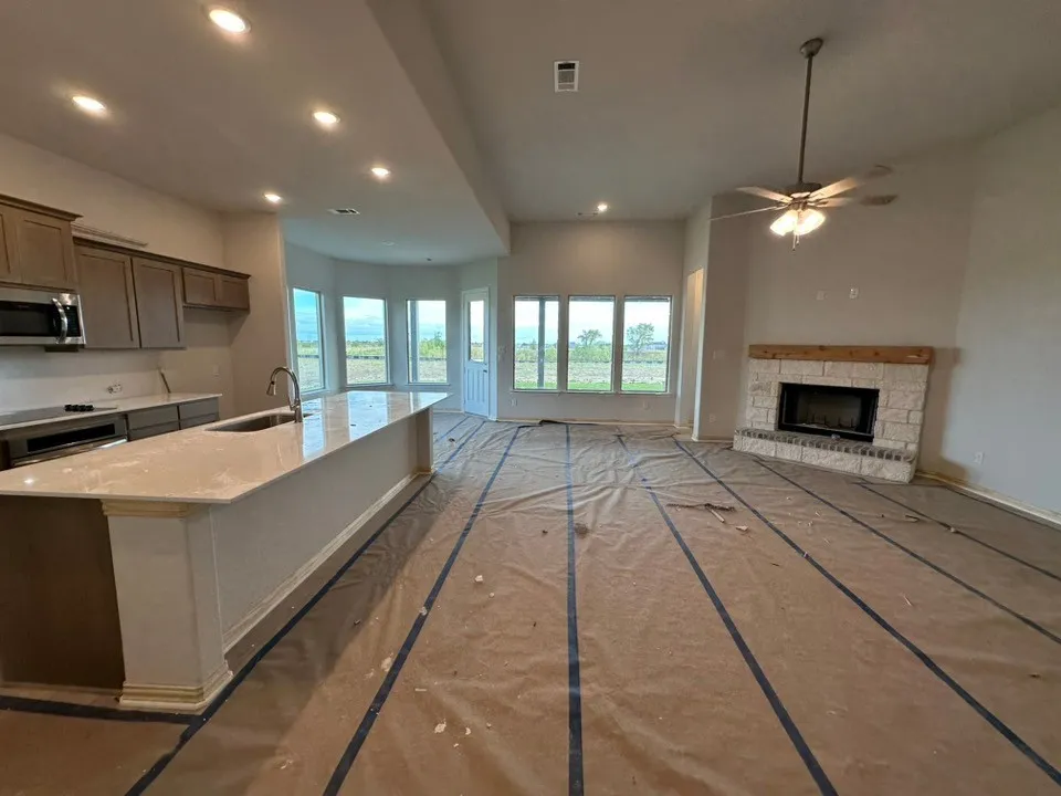 Kitchen island with an undermount sink and a gooseneck faucet