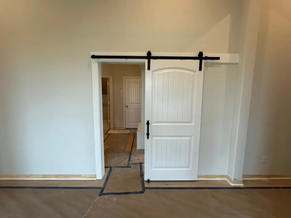 White barn door with black hardware