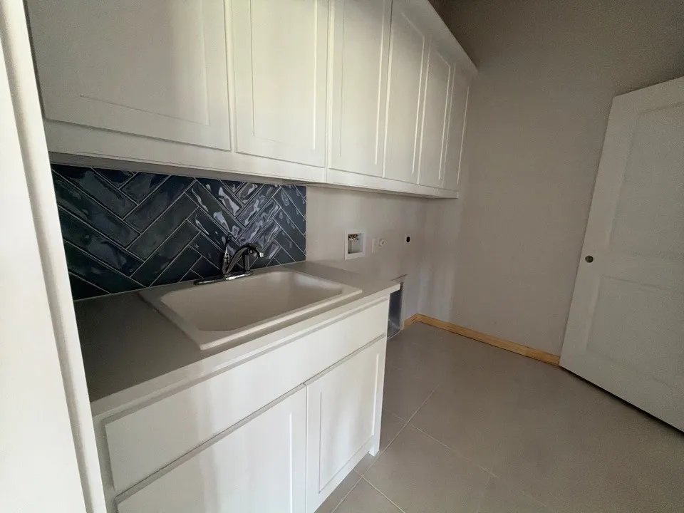White shaker-style cabinetry with ample storage