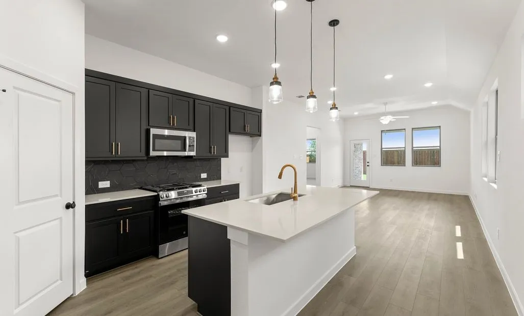 Open Kitchen-Living-Dining Room Representative Photo featuring the Noir Collection