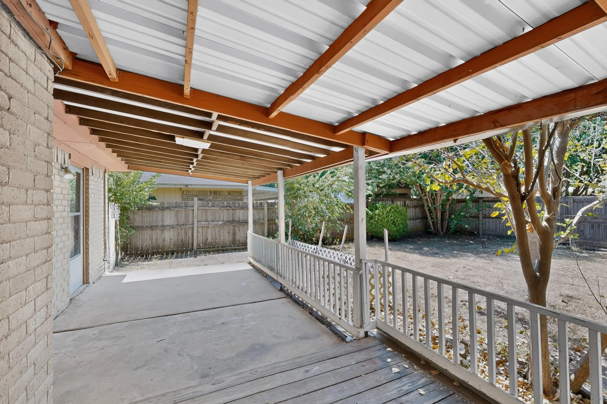 Covered entrance off Kitchen in back yard