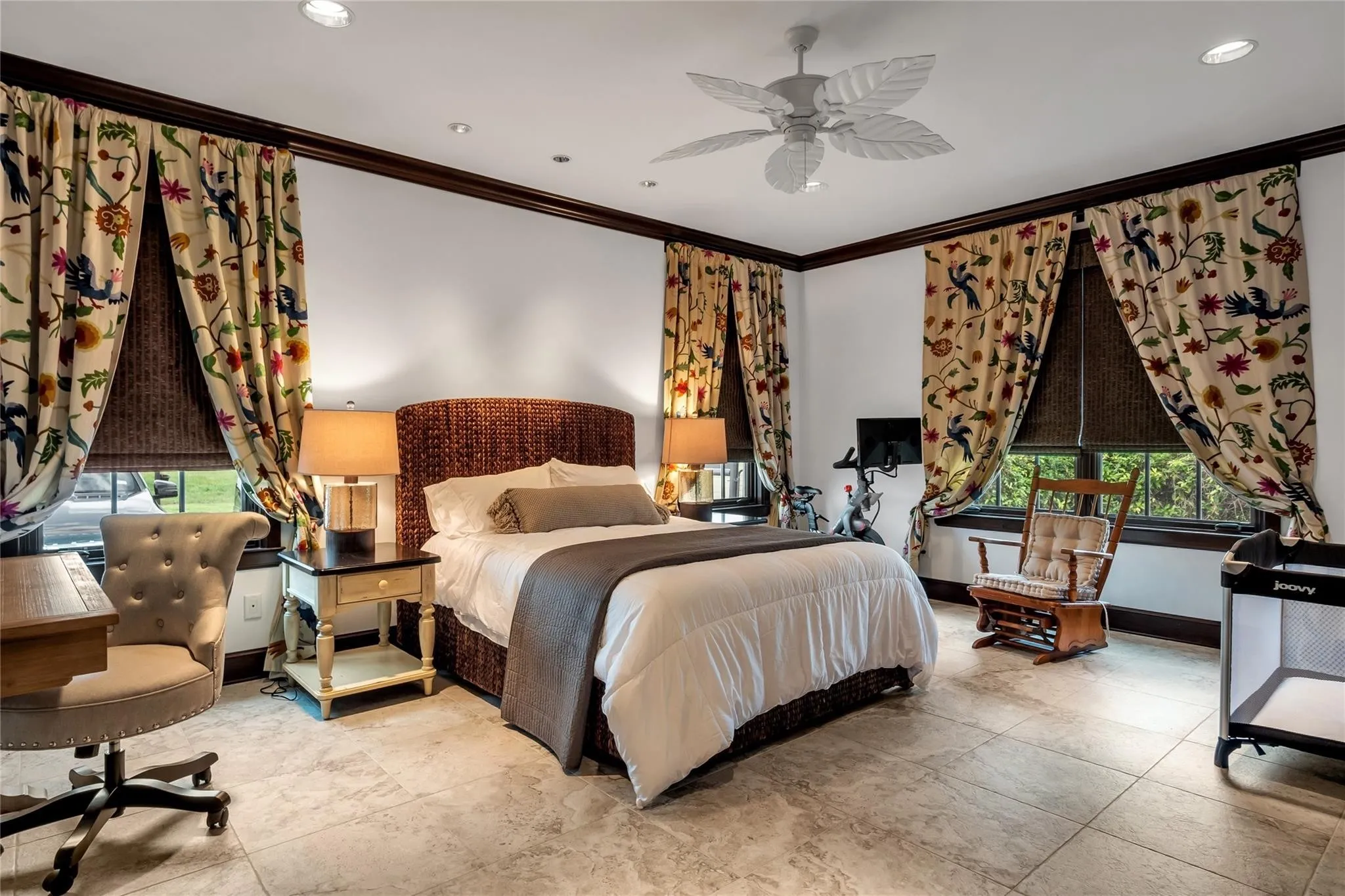 Recessed lighting, crown molding, ceiling fan, tile flooring, and multiple windows with blinds