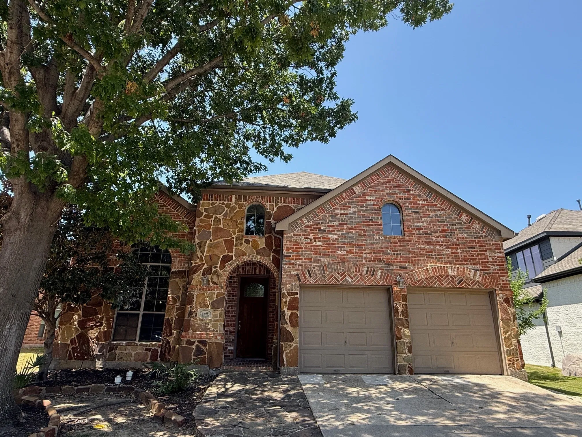 Stone and brick facade with arched entryways