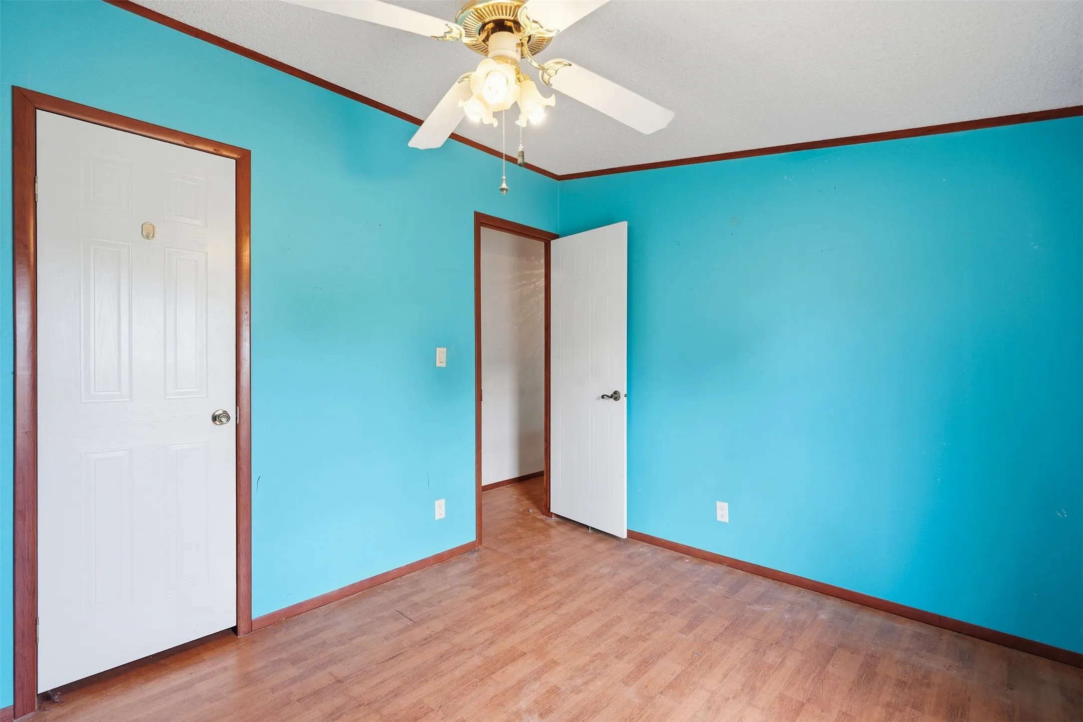4th bedroom - Wood-finish flooring with vibrant wall color