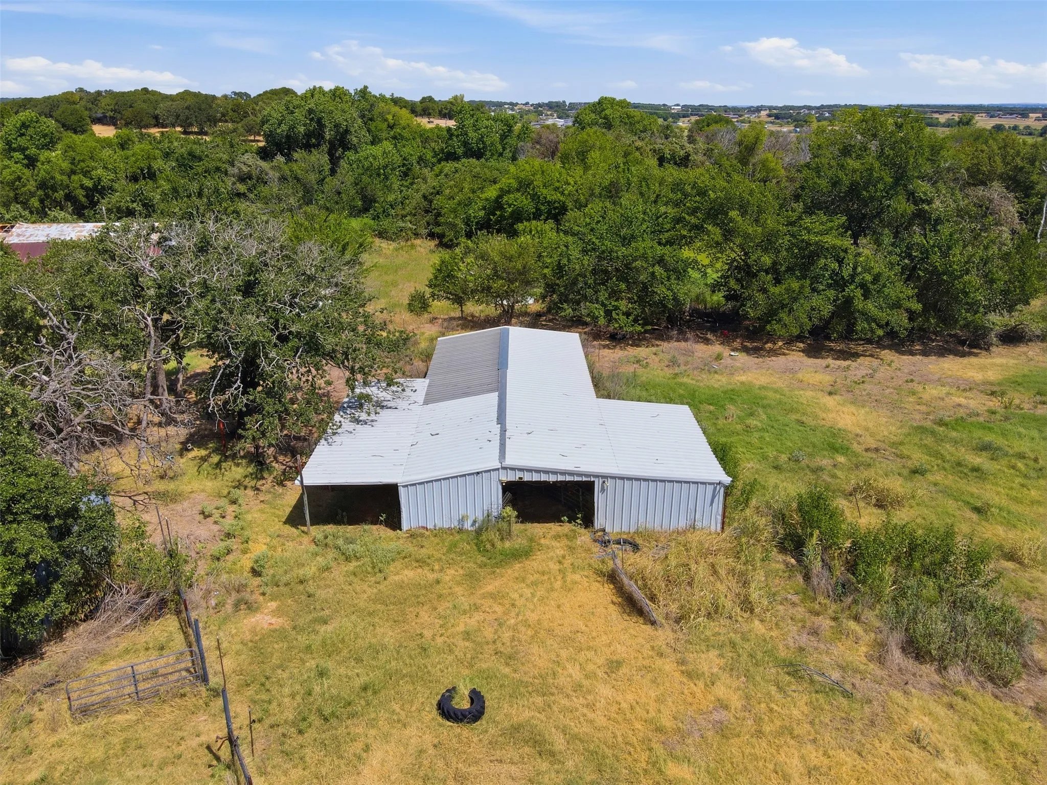 6 stall Metal-sided barn structure with a pitched metal roof