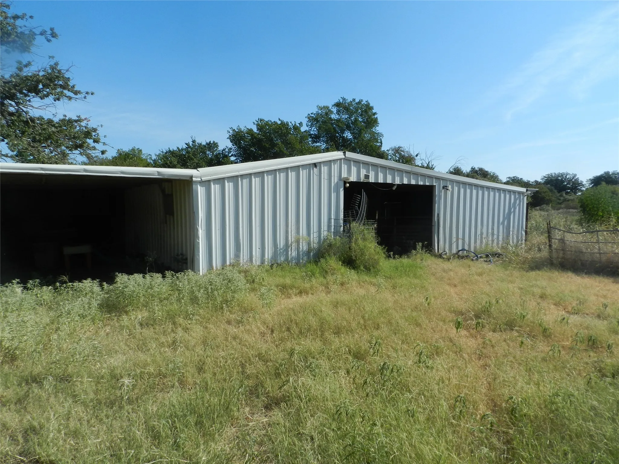 6 stall barn with an open-sided lean-to and enclosed storage area