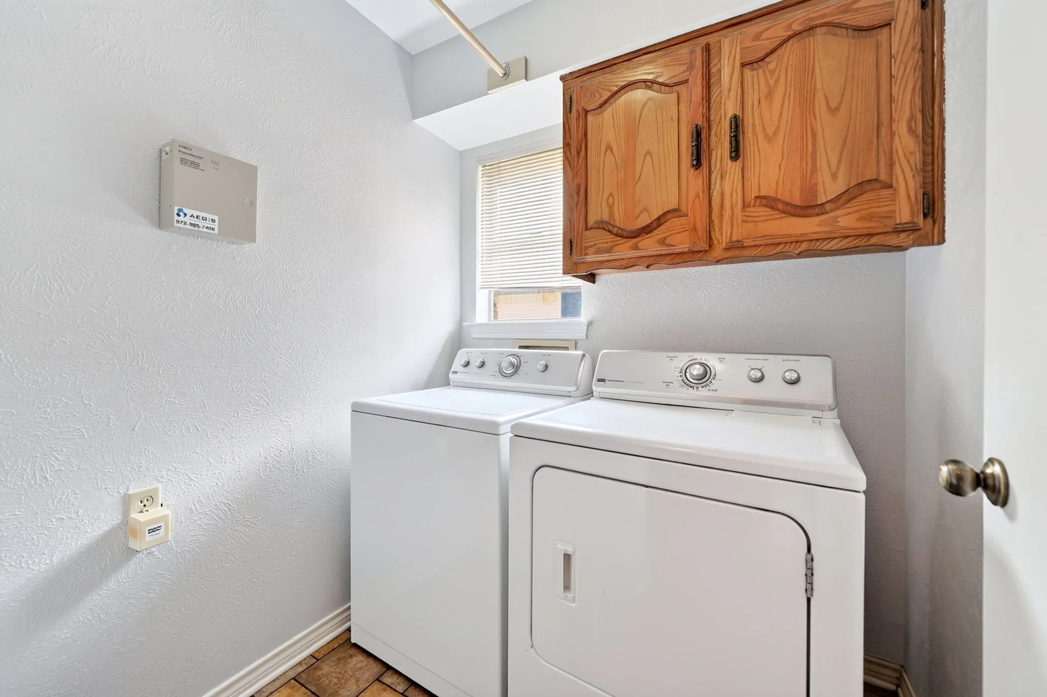 Upper cabinetry with wood-finish doors