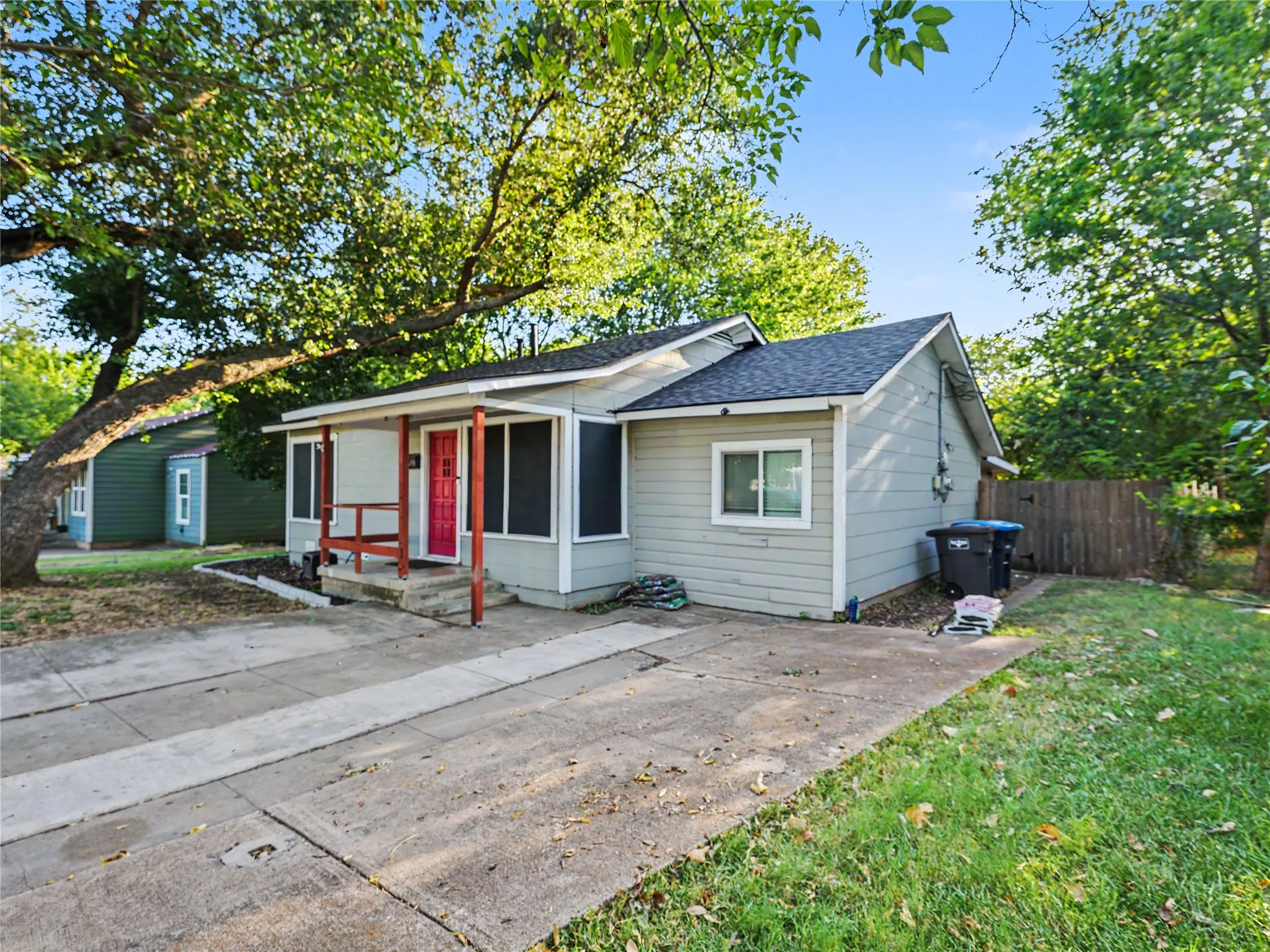 Covered front porch with red door