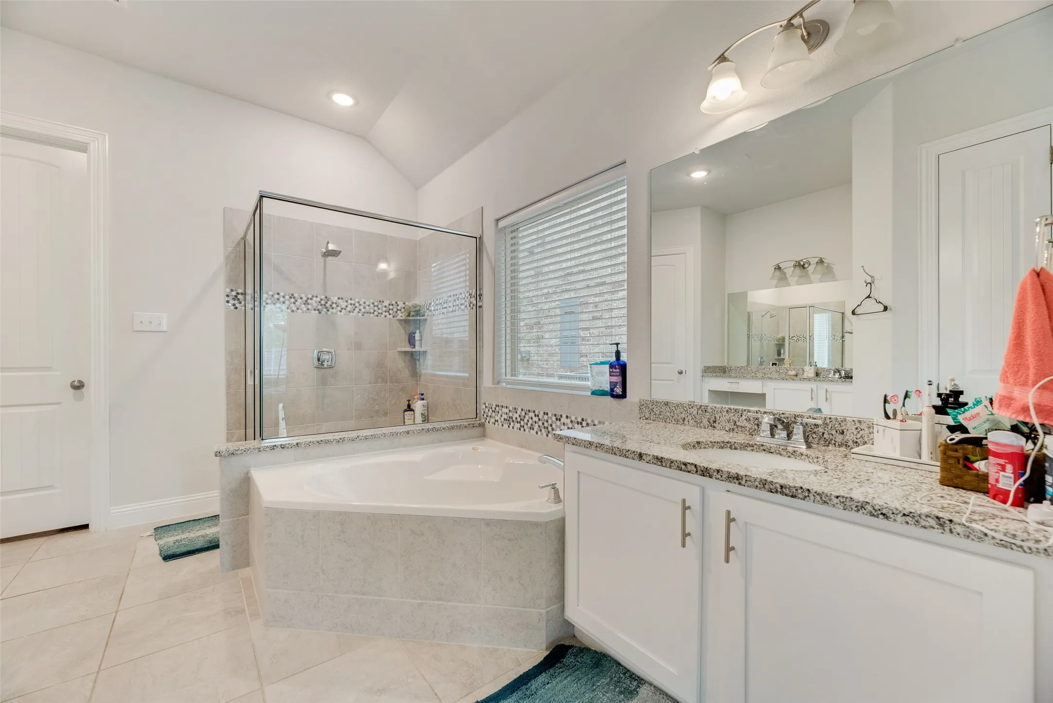 Full bath featuring a tile shower, tile patterned flooring, vanity, recessed lighting, and a garden tub