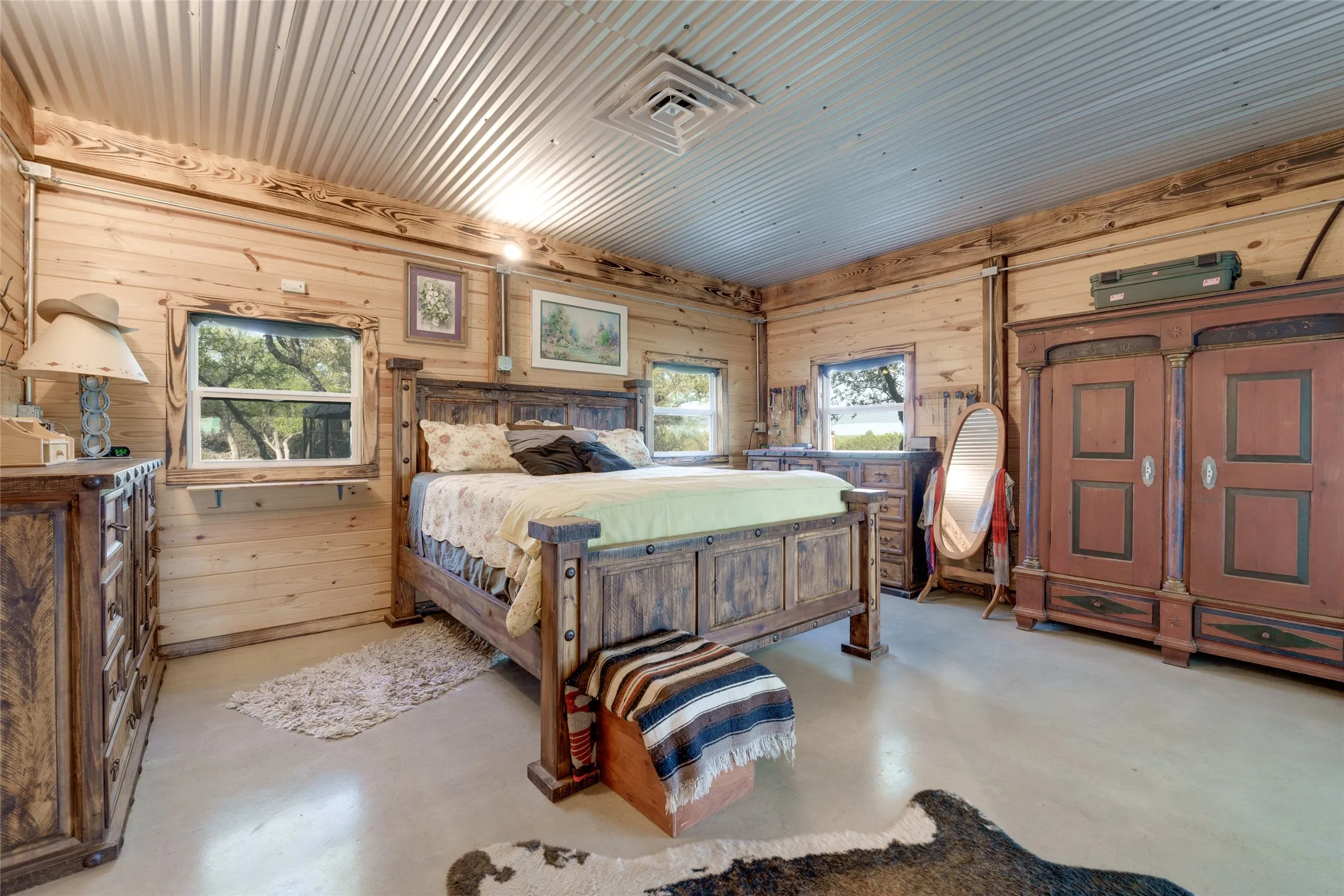 Wood-paneled walls and a corrugated metal ceiling