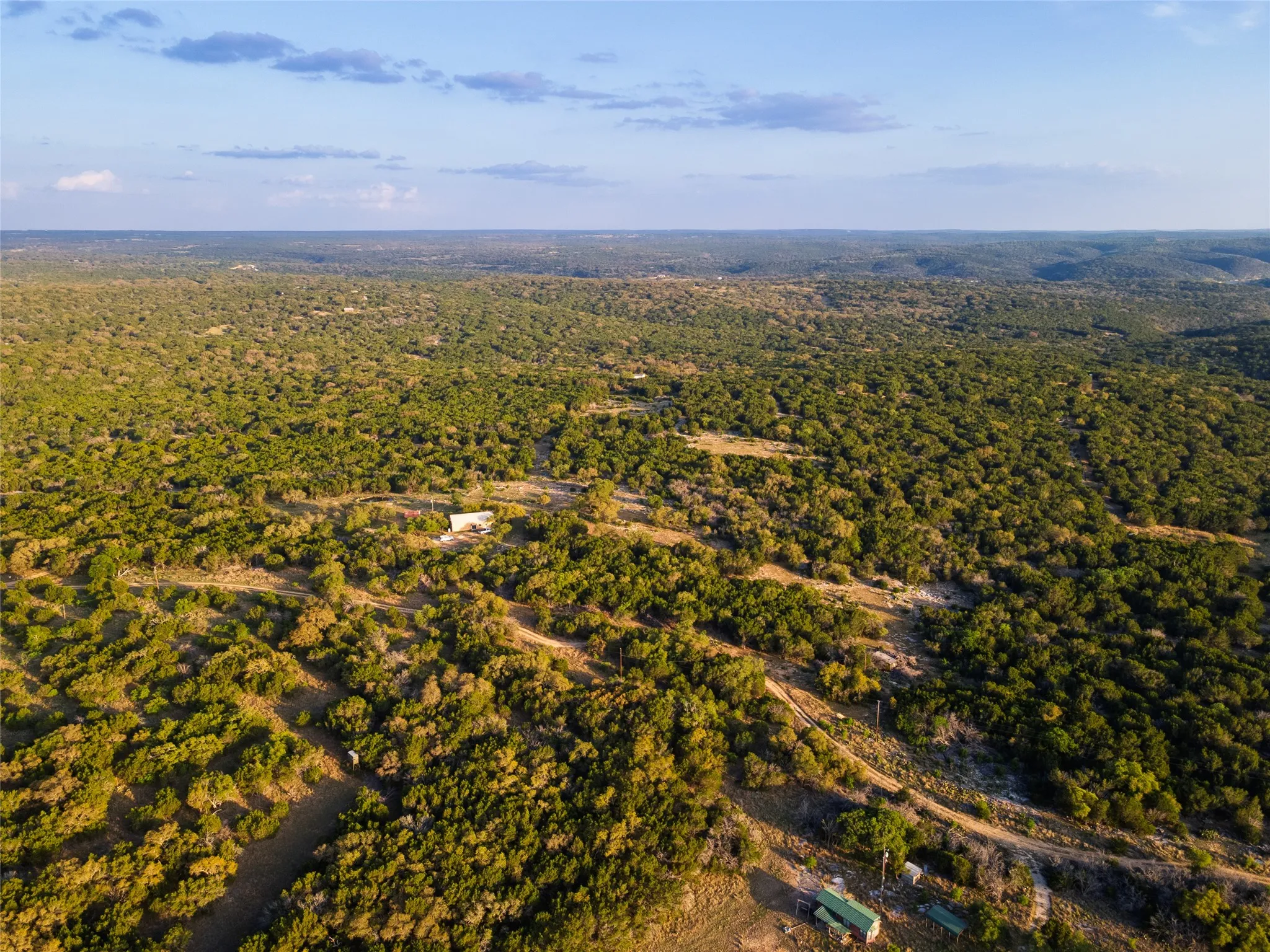 Expansive natural landscape with varied topography and dense tree coverage