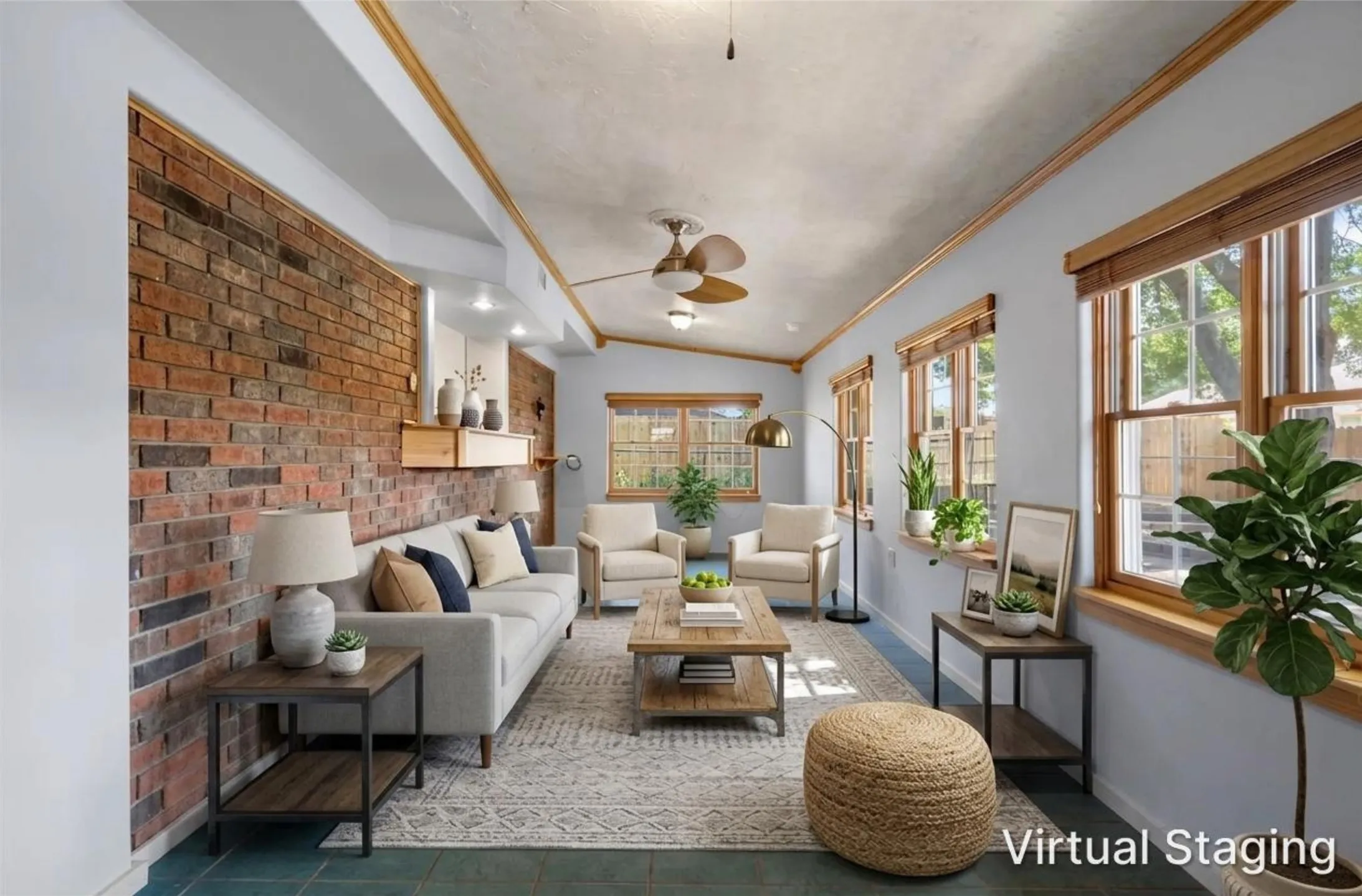Character-filled sunroom with exposed brick accent wall and wood beam ceiling