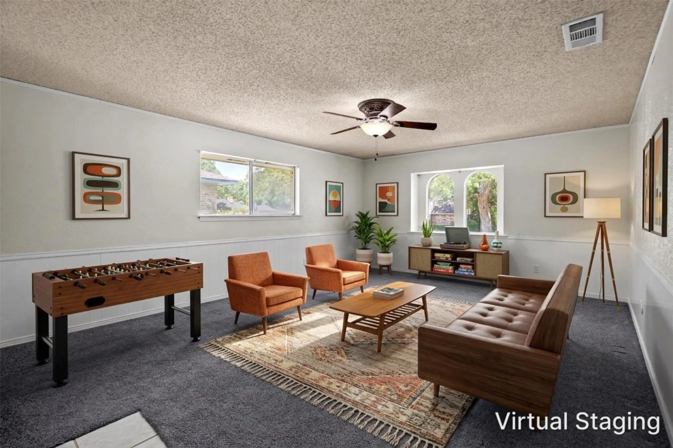 Virtual staging showcasing a spacious room with carpet flooring, white paneled wainscoting, and multiple windows