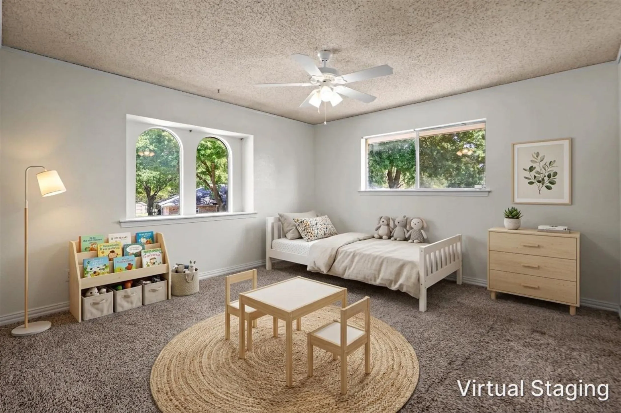 Arched window accents, ceiling fan with light, and light-colored wall finishes