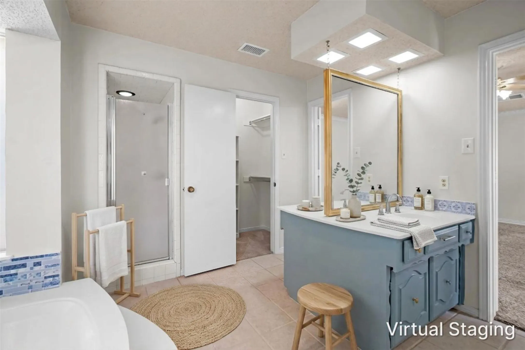 Recessed lighting, enclosed shower, single vanity with countertop, framed mirror, and tile flooring