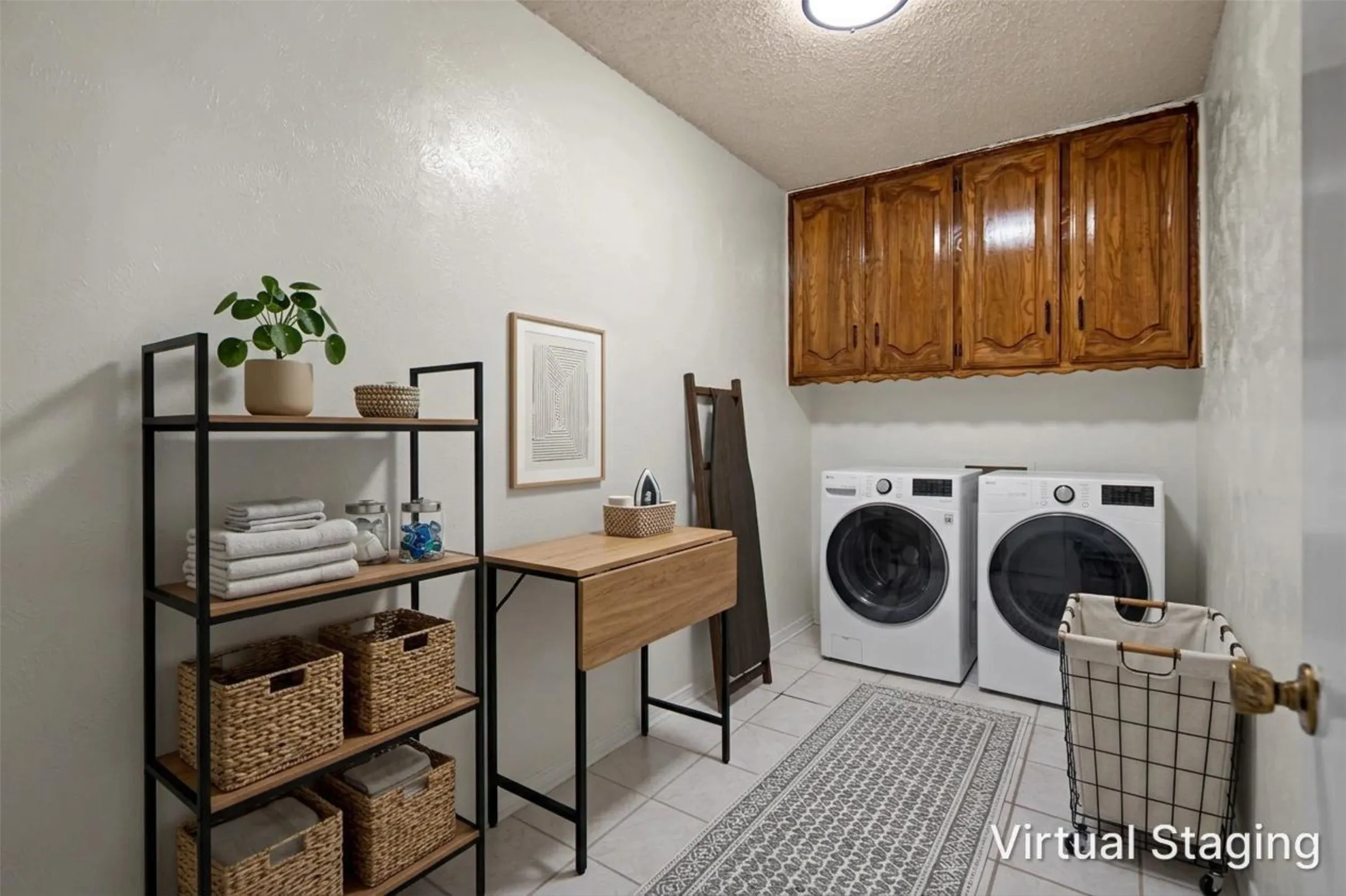 White tile flooring, overhead wood-finish cabinetry, and a ceiling-mounted light fixture