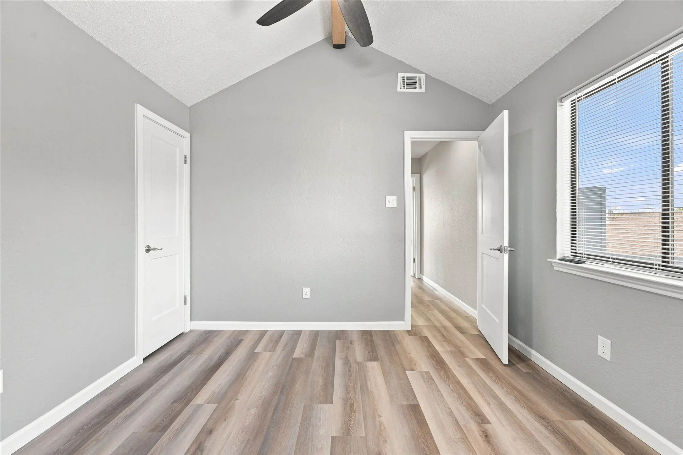 Open, bright upstairs bedroom with vaulted beam ceilings!