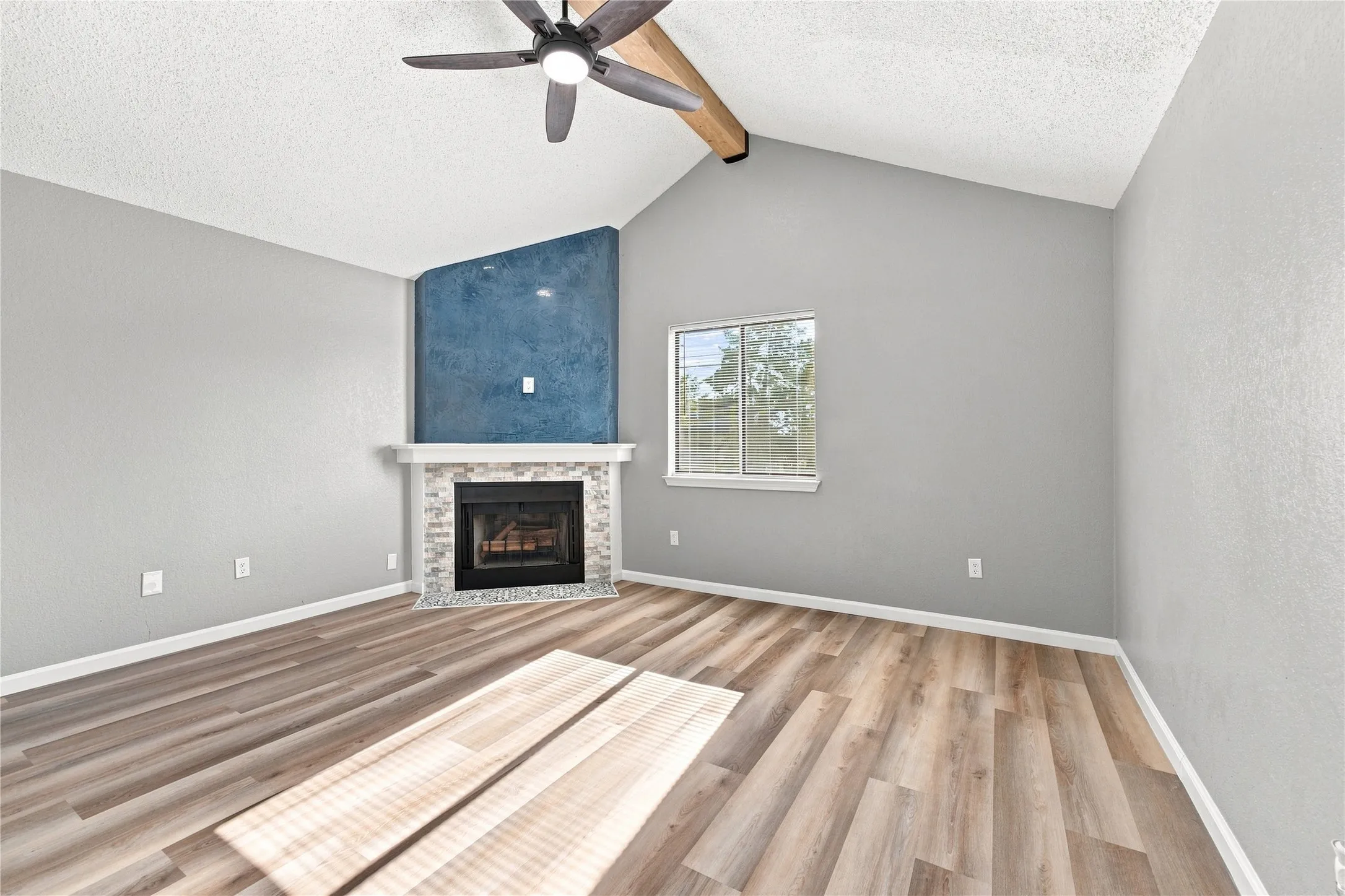 Primary bedroom thoughtfully remodeled with working fireplace.