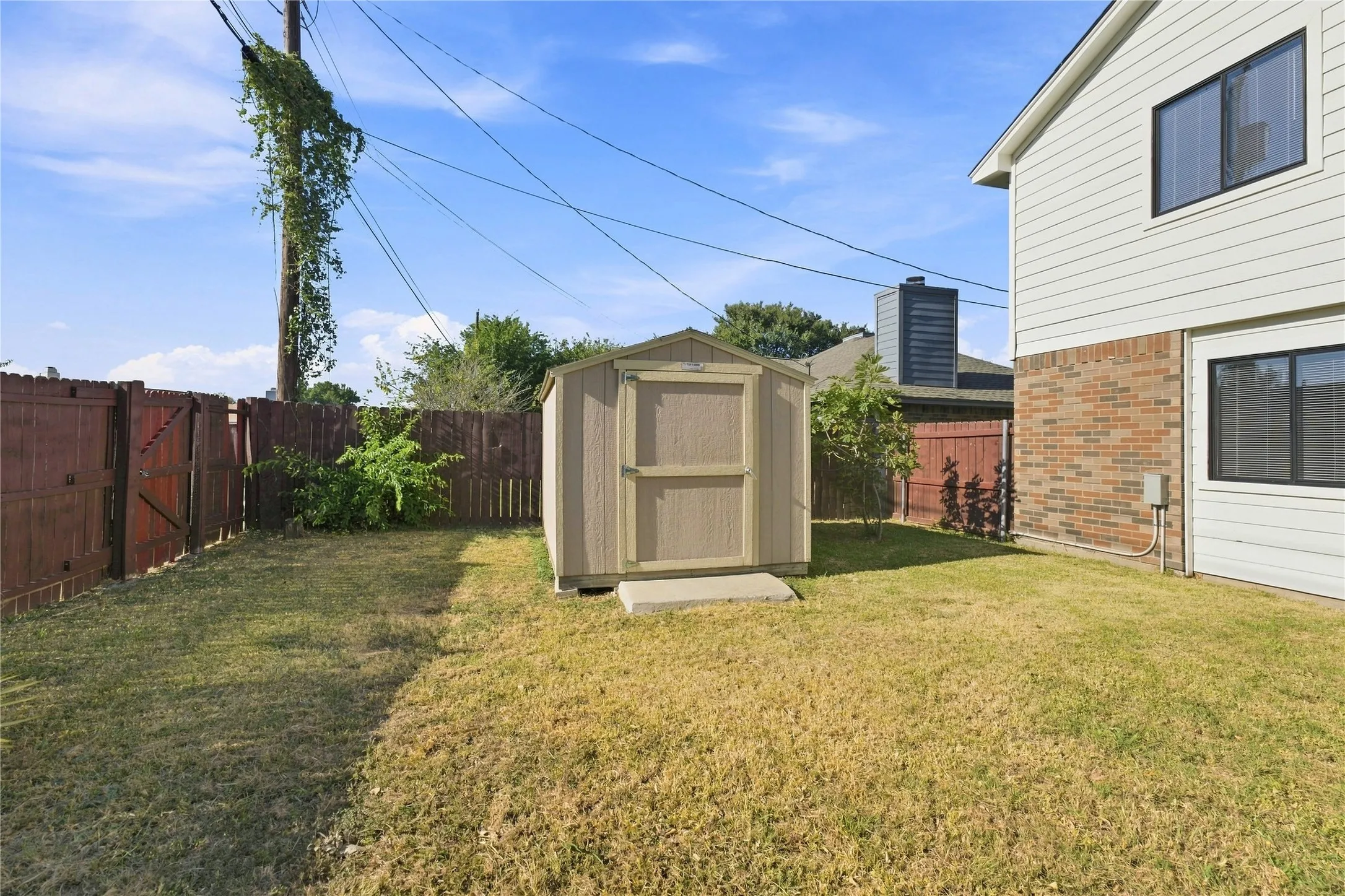 Detached backyard workshop offering versatile space for projects, hobbies, storage, or additional workspace.