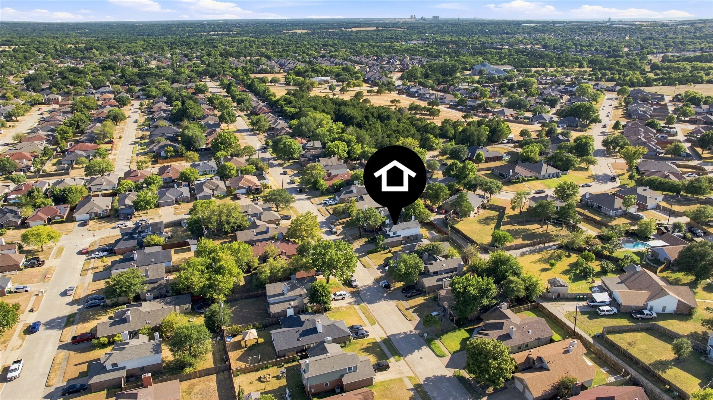 Aerial view showcasing the surrounding neighborhood and community setting.