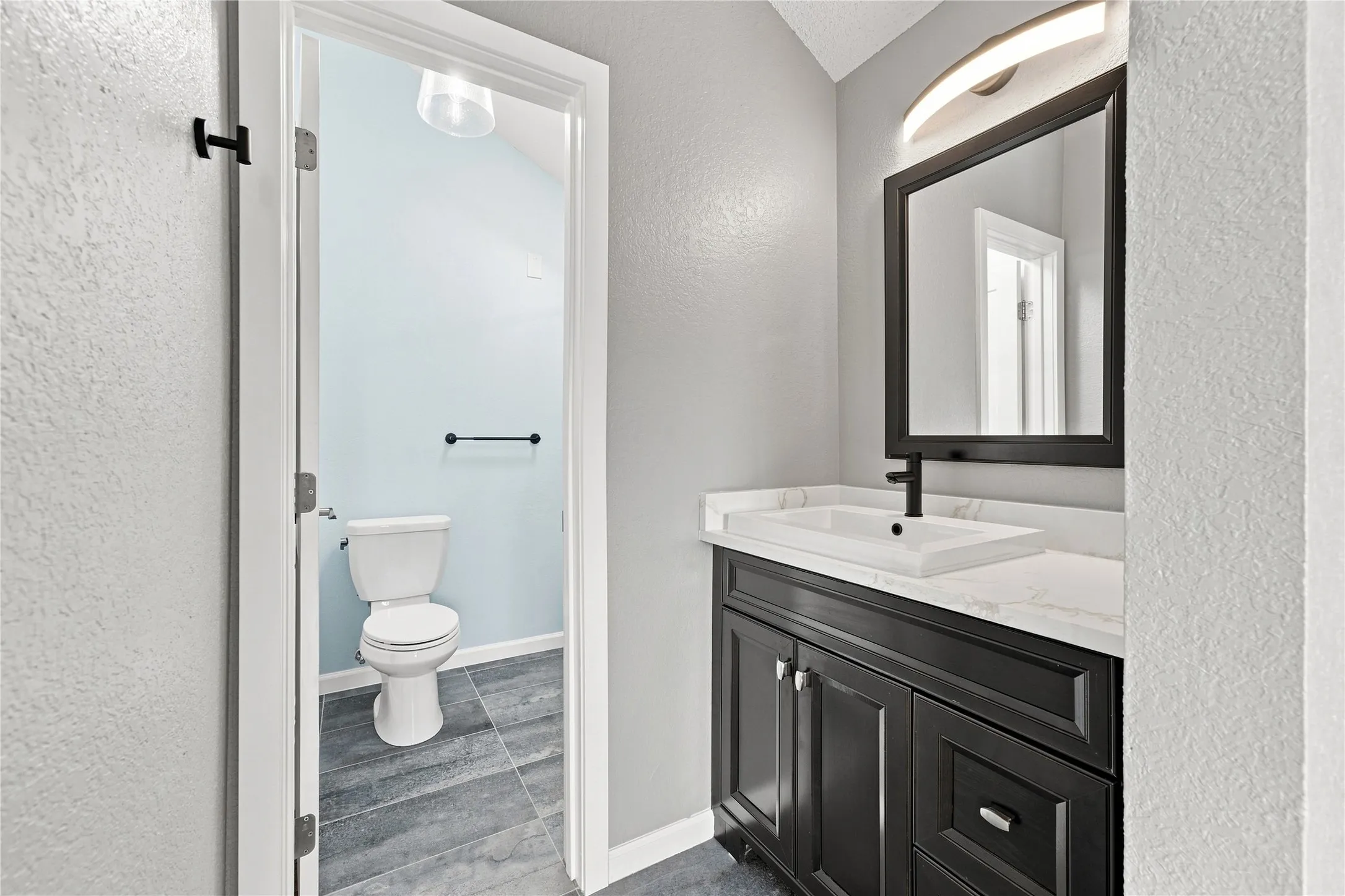 Primary bathroom with sky light and luxury finishes!