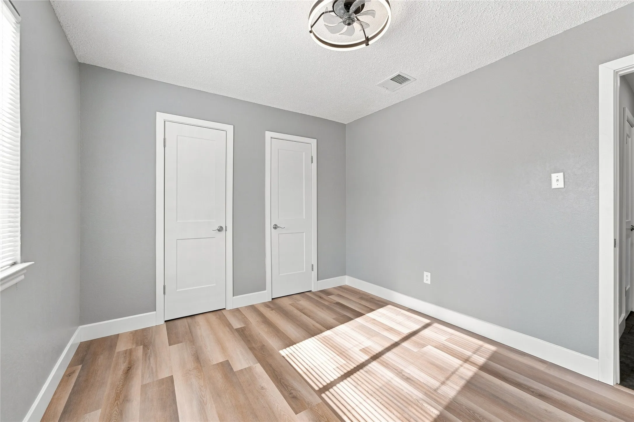 Inviting bedroom with double closets, providing ample storage and convenient organization.